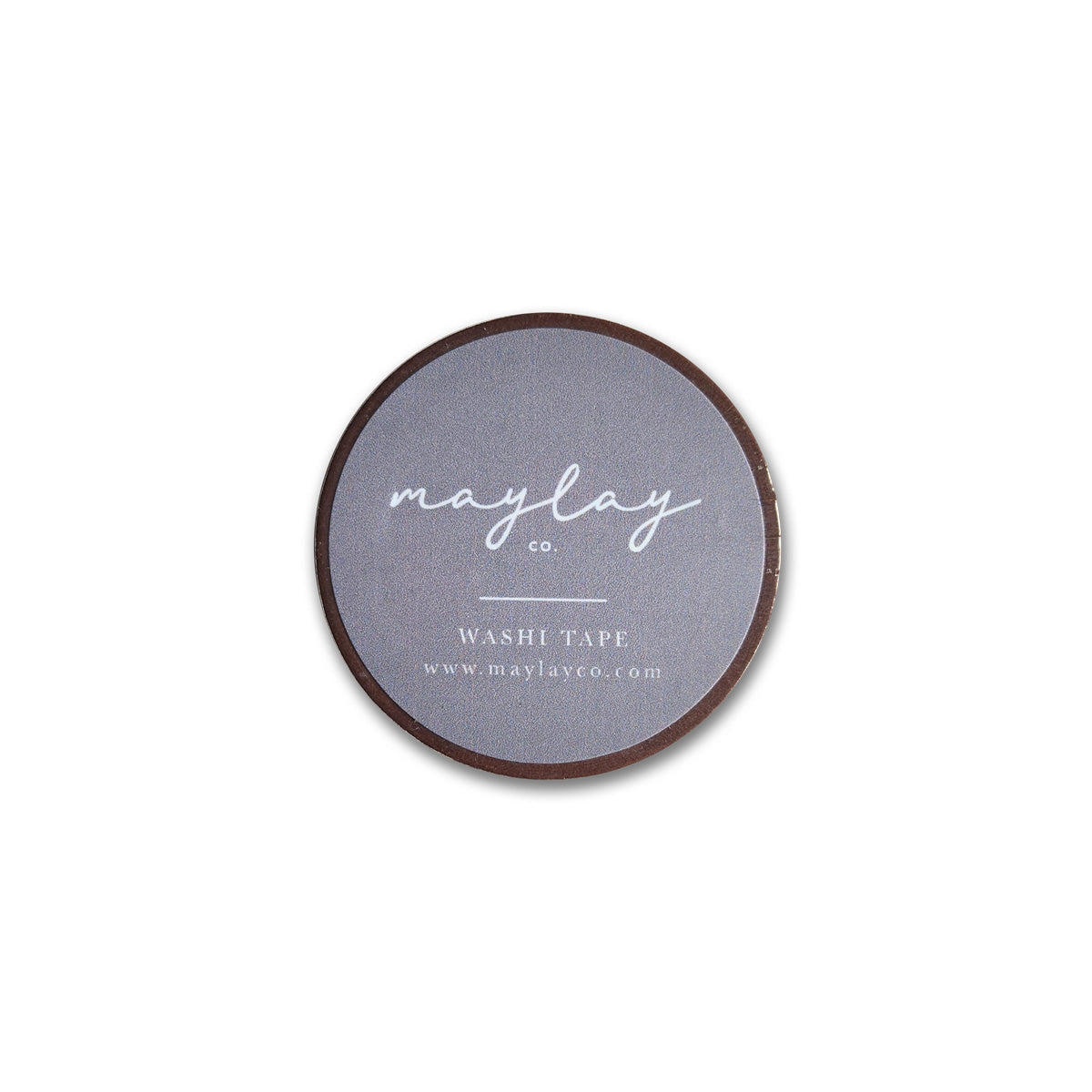The Tang Washi Tape from Maylay Co. is a round, flat roll of decorative tape featuring a gray label with white text that reads "may lay co. WASHI TAPE www.maylayco.com." It's perfect for scrapbooking projects and is photographed against a plain white background.